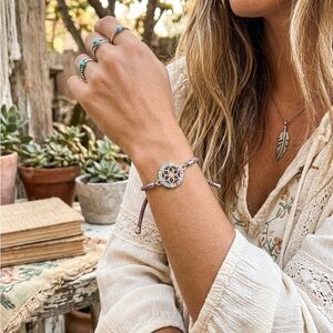 Hand Crafted Purple Braided Bracelet with Multicolor Floral Charm